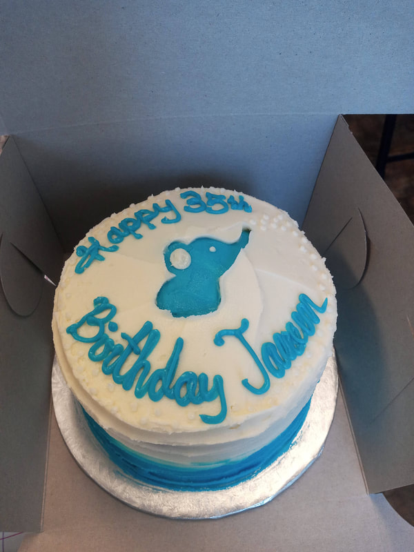 35th birthday cake with blue writing and elephant picture