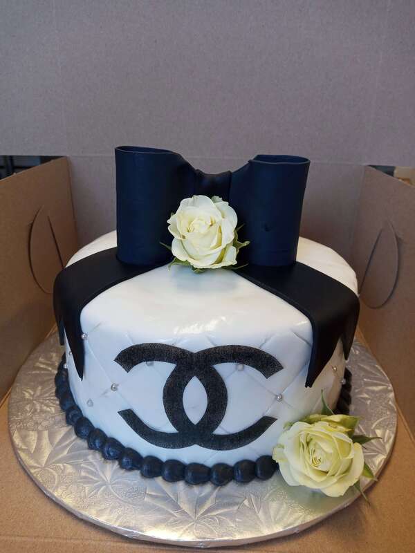 Chanel cake with black bow and white rose