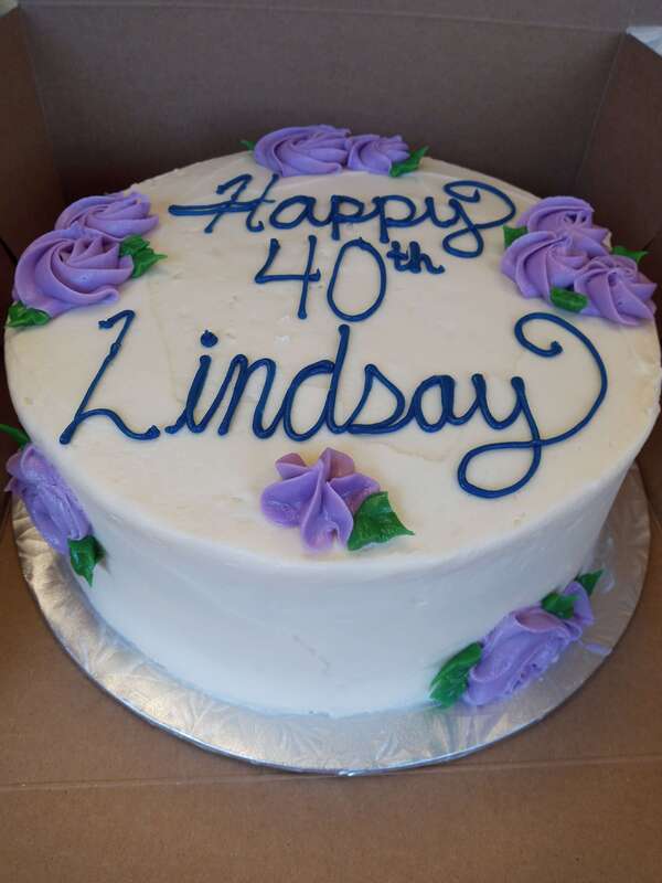 White cake with purple flowers