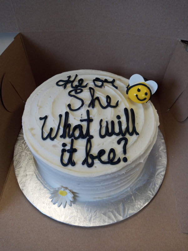 White cake with a bee