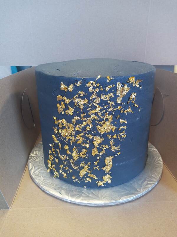Navy blue cake with gold leaf