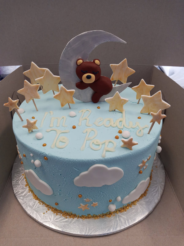 sky cake with stars and a bear sleeping on the moon