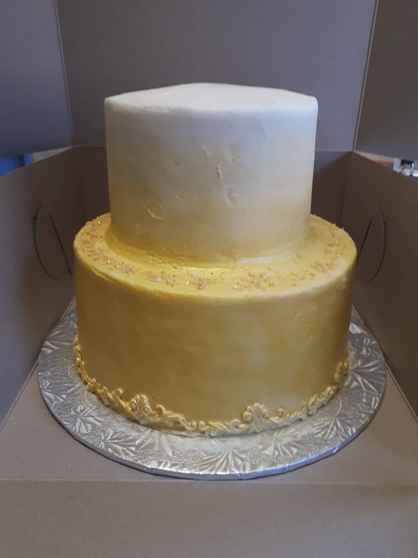 Two tiered gold to whit gradient cake